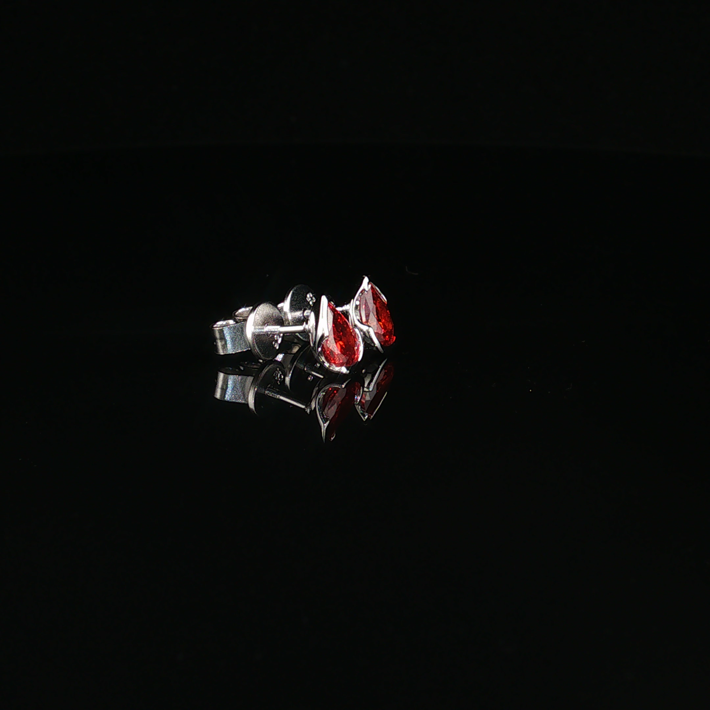 Pear-Shaped Deep Garnet Stud Earrings in premium sterling silver
