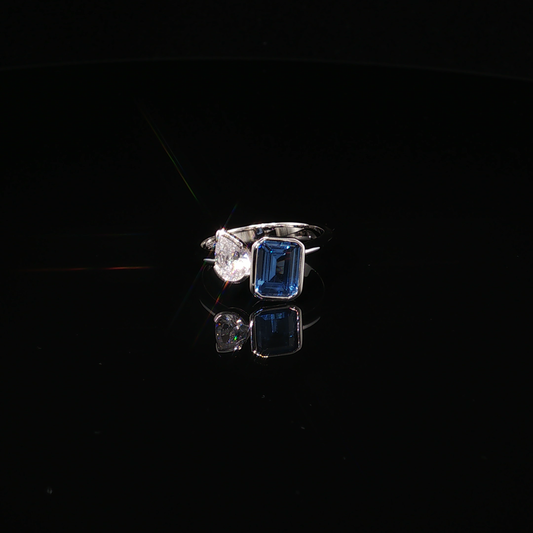 Premium Sterling Silver Toi et Moi Ring with Emerald-Cut London Blue Topaz and Pear Zirconium