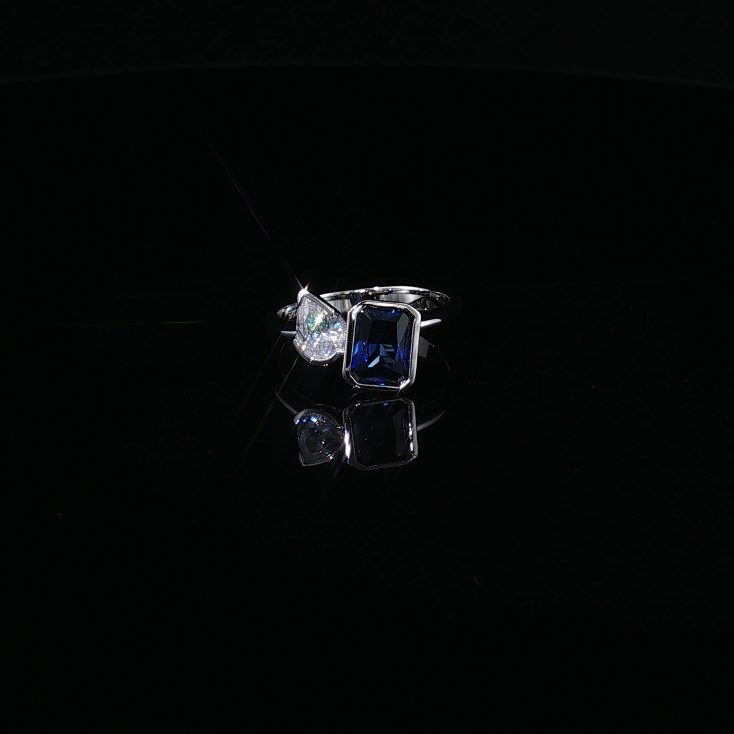 Emerald-Cut Royal Blue Sapphire and Pear-Cut Zirconium Bypass Ring in Sterling silver 925