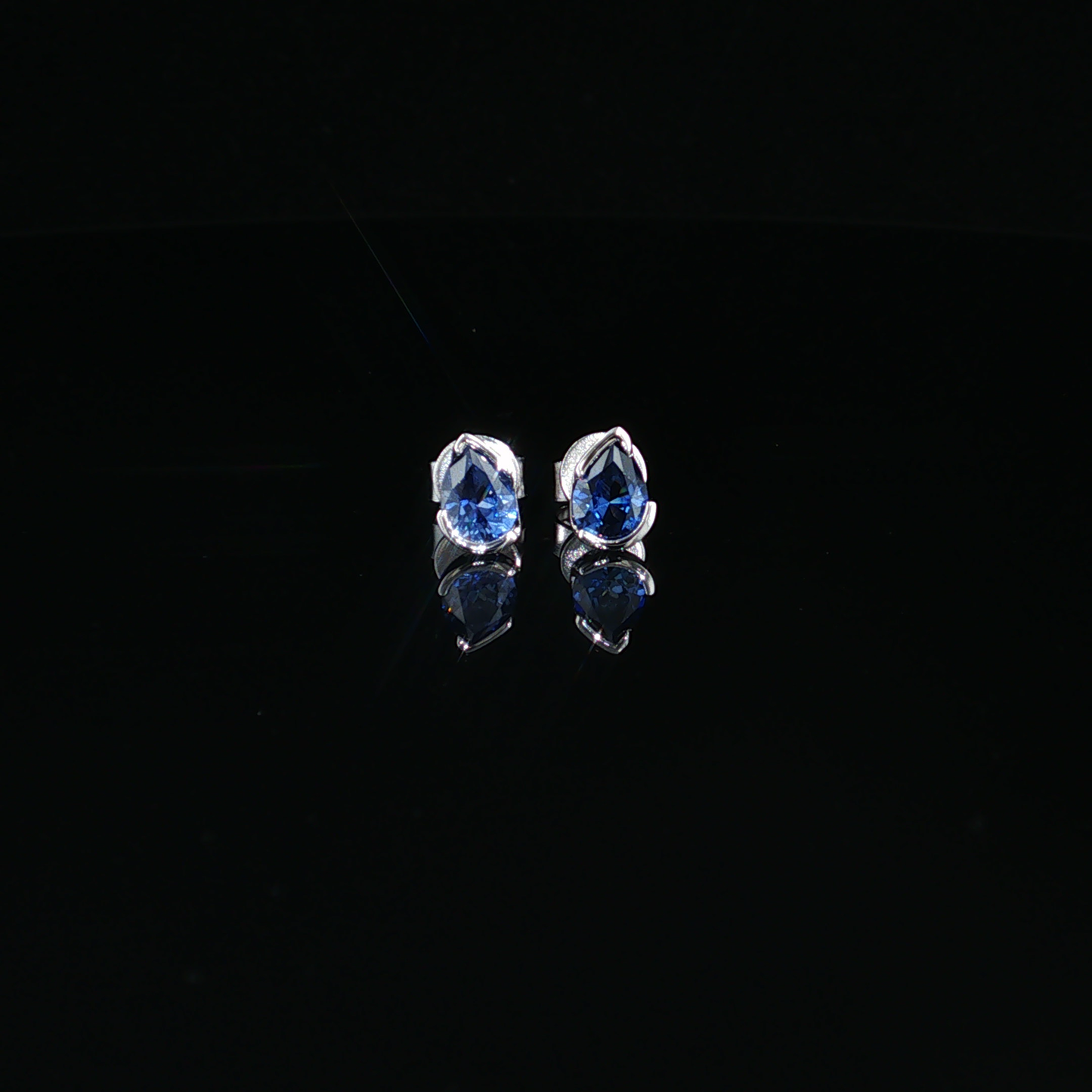 Royal Blue Pear Cut Sapphire Stud Earrings in premium Sterling Silver