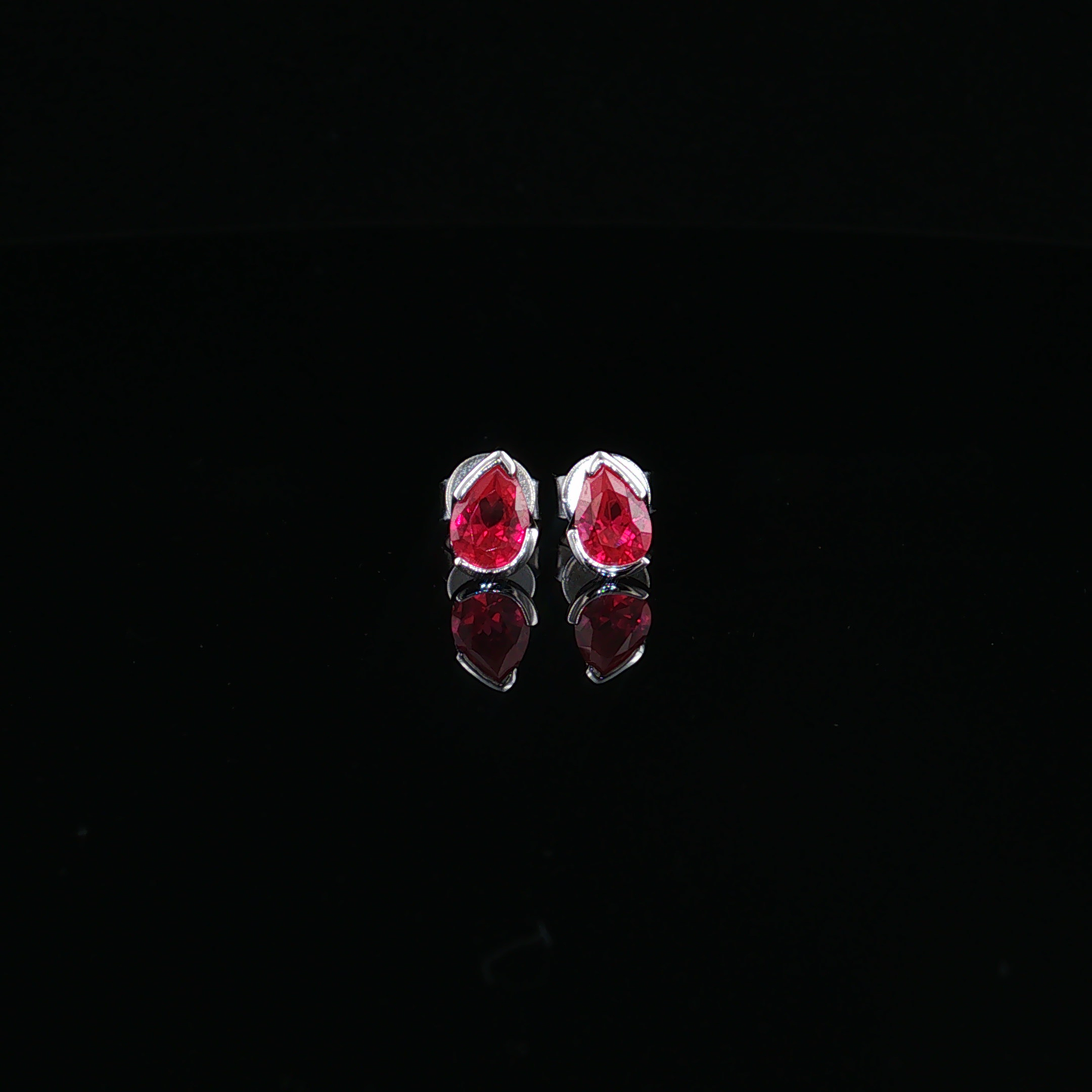 Pear-Shaped Ruby Stud Earrings in premium Sterling silver