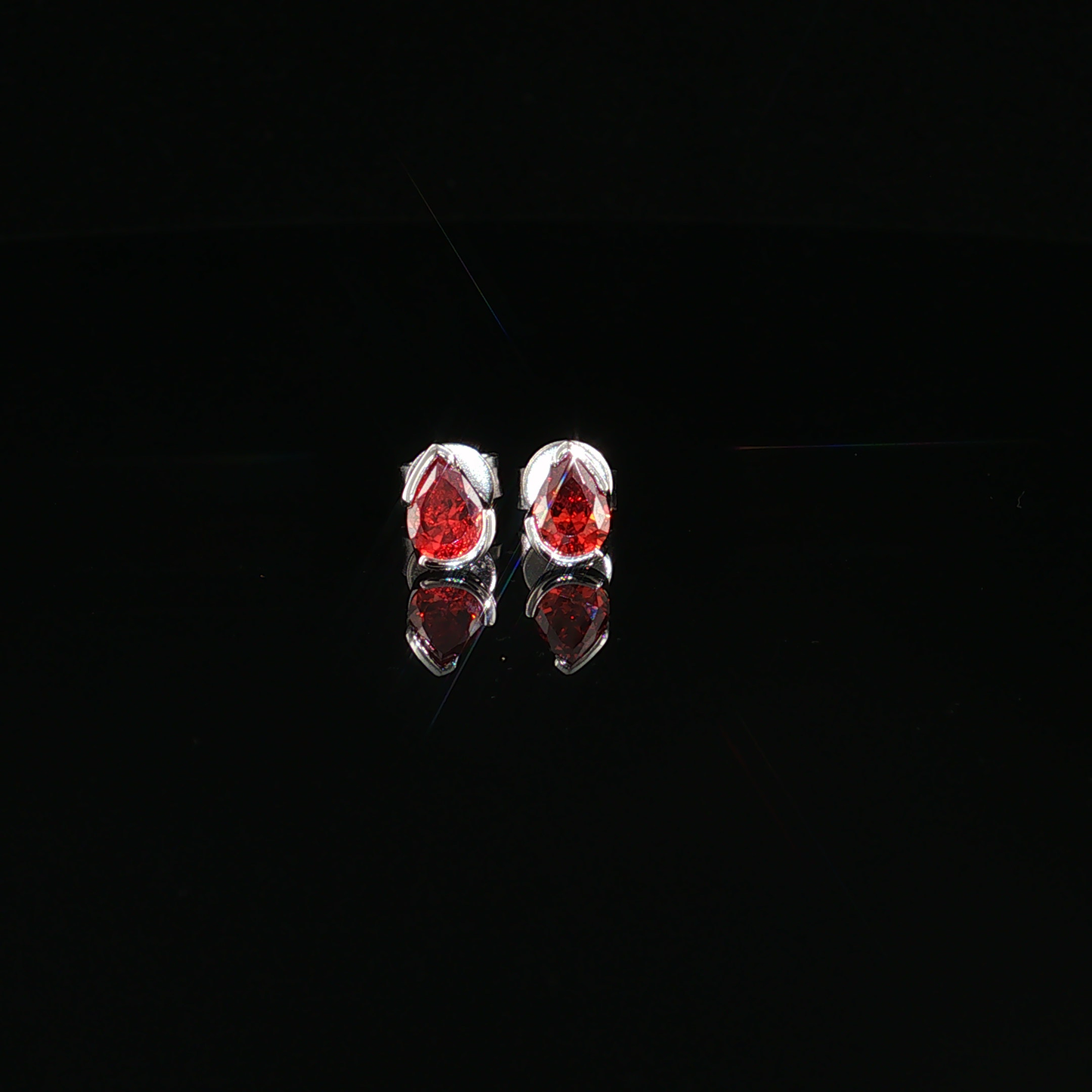 Pear-Shaped Deep Garnet Stud Earrings in premium sterling silver