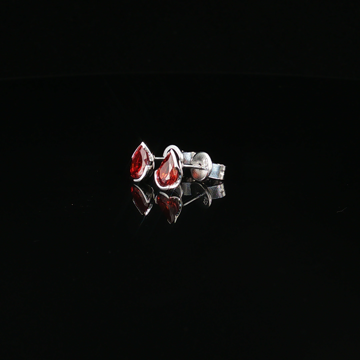 Pear-Shaped Deep Garnet Stud Earrings in premium sterling silver