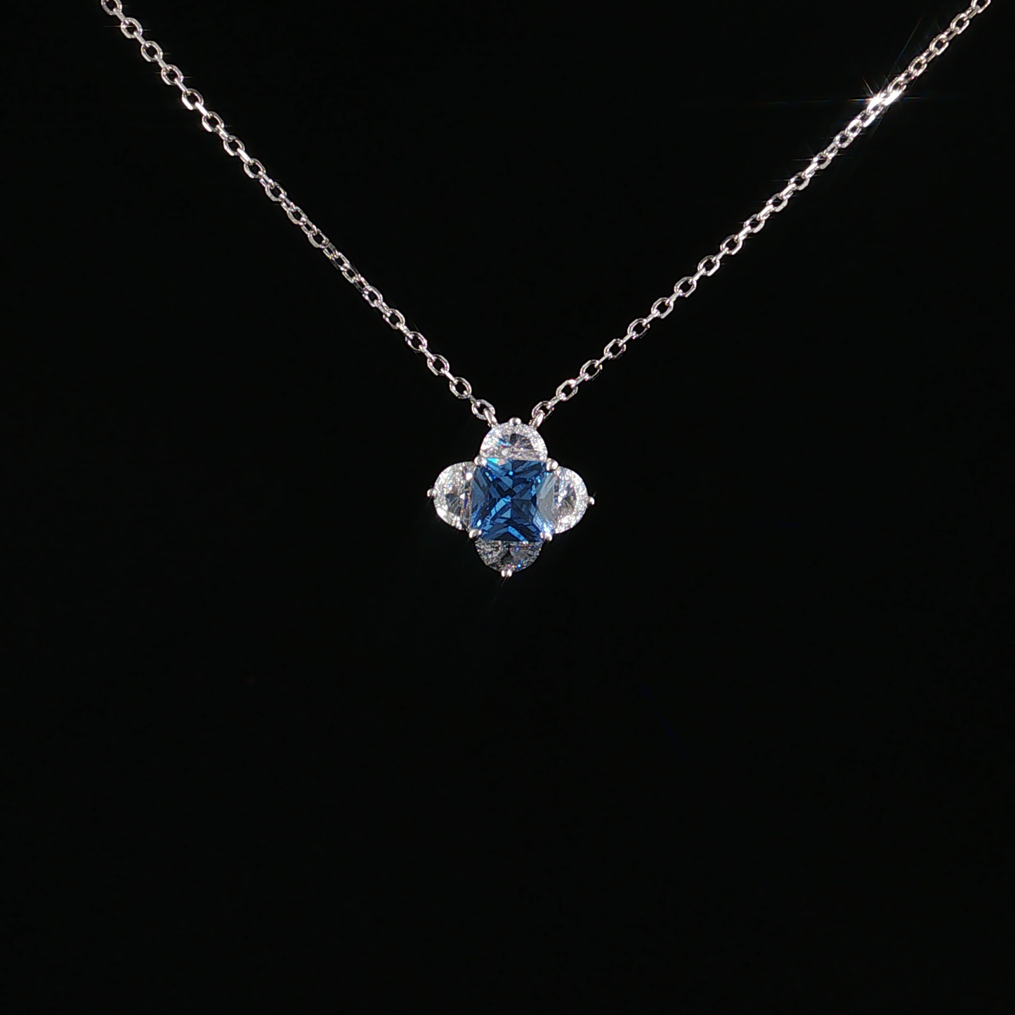 Blue Topaz Quatrefoil Charm Necklace in Sterling Silver