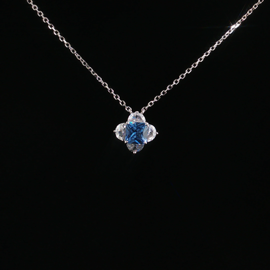 Blue Topaz Quatrefoil Charm Necklace in Sterling Silver
