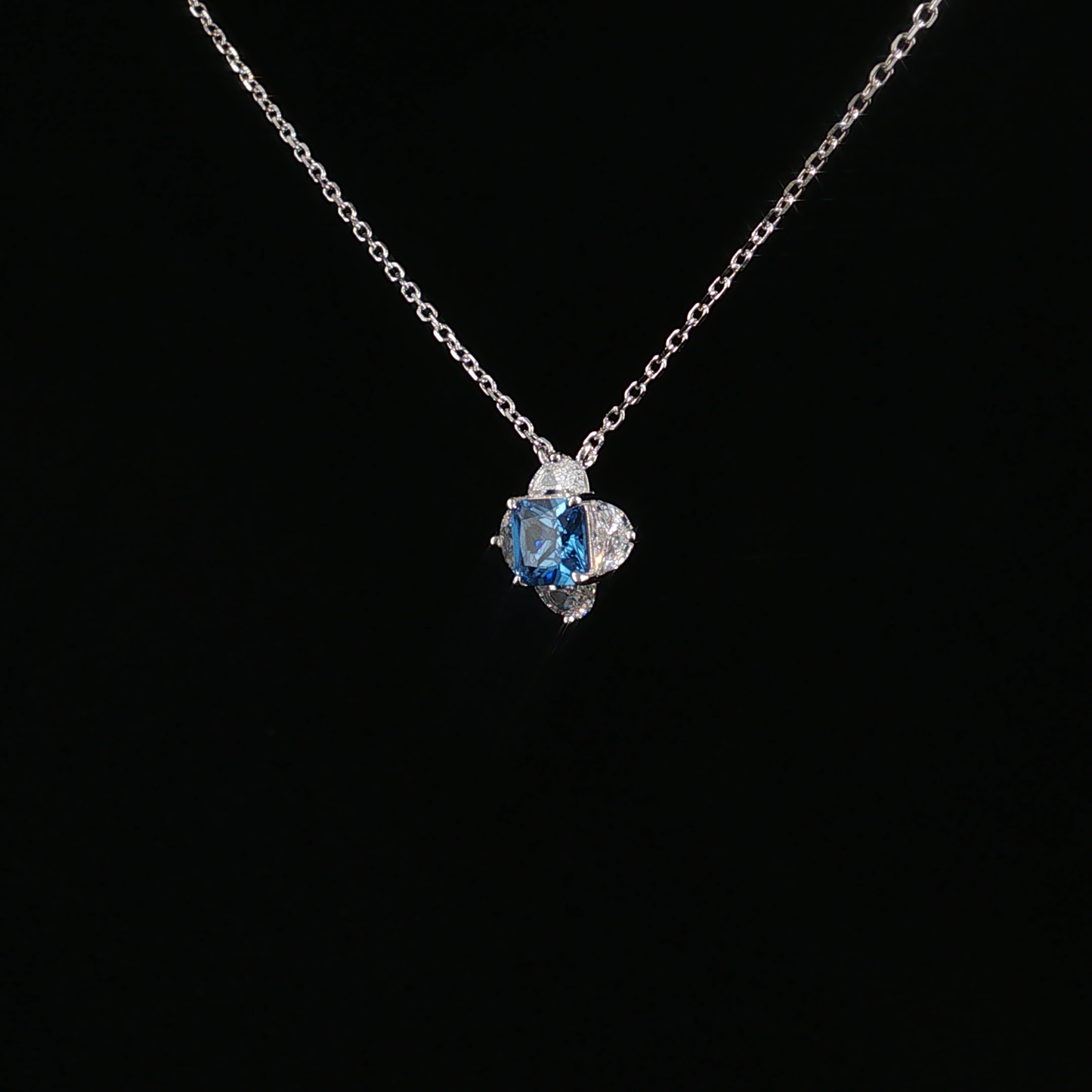 Blue Topaz Quatrefoil Charm Necklace in Sterling Silver