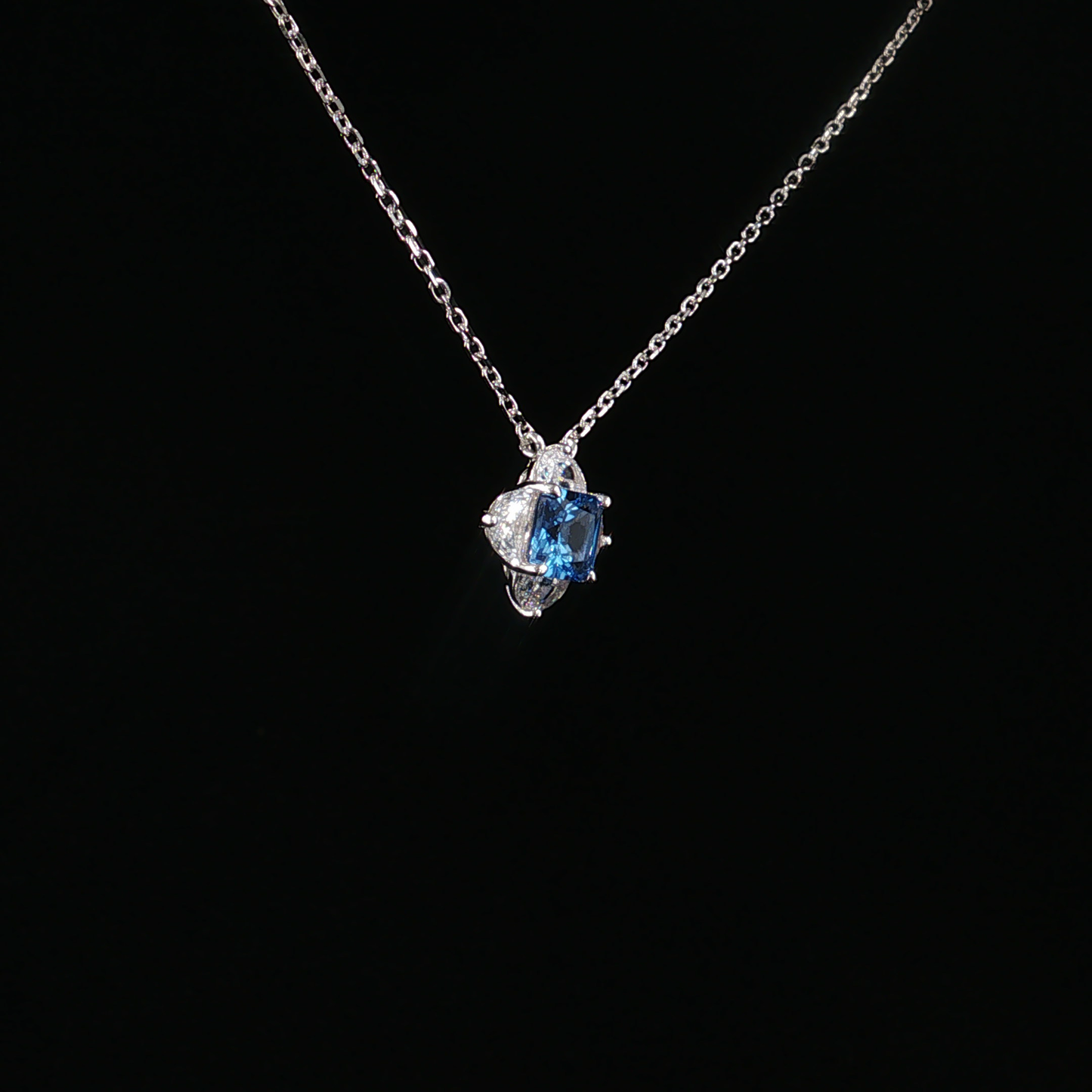 Blue Topaz Quatrefoil Charm Necklace in Sterling Silver